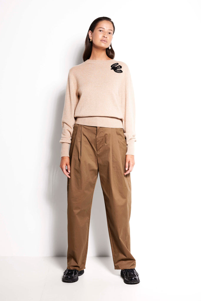 Swallow Cashmere Crew – Beige long sleeve crew neck jumper with black embroidery detail